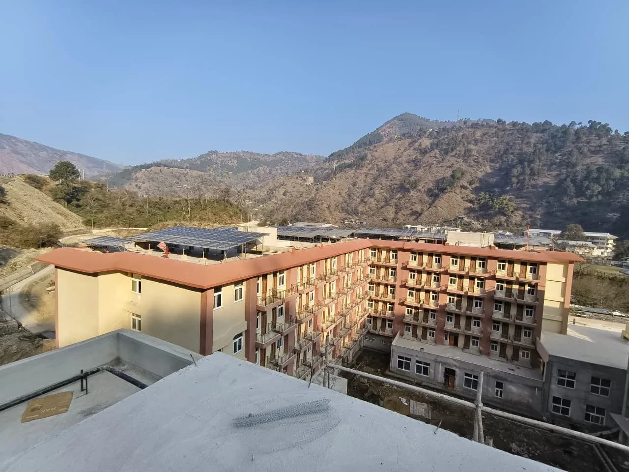 IIT Mandi campus buildings with solar panels across their rooftops