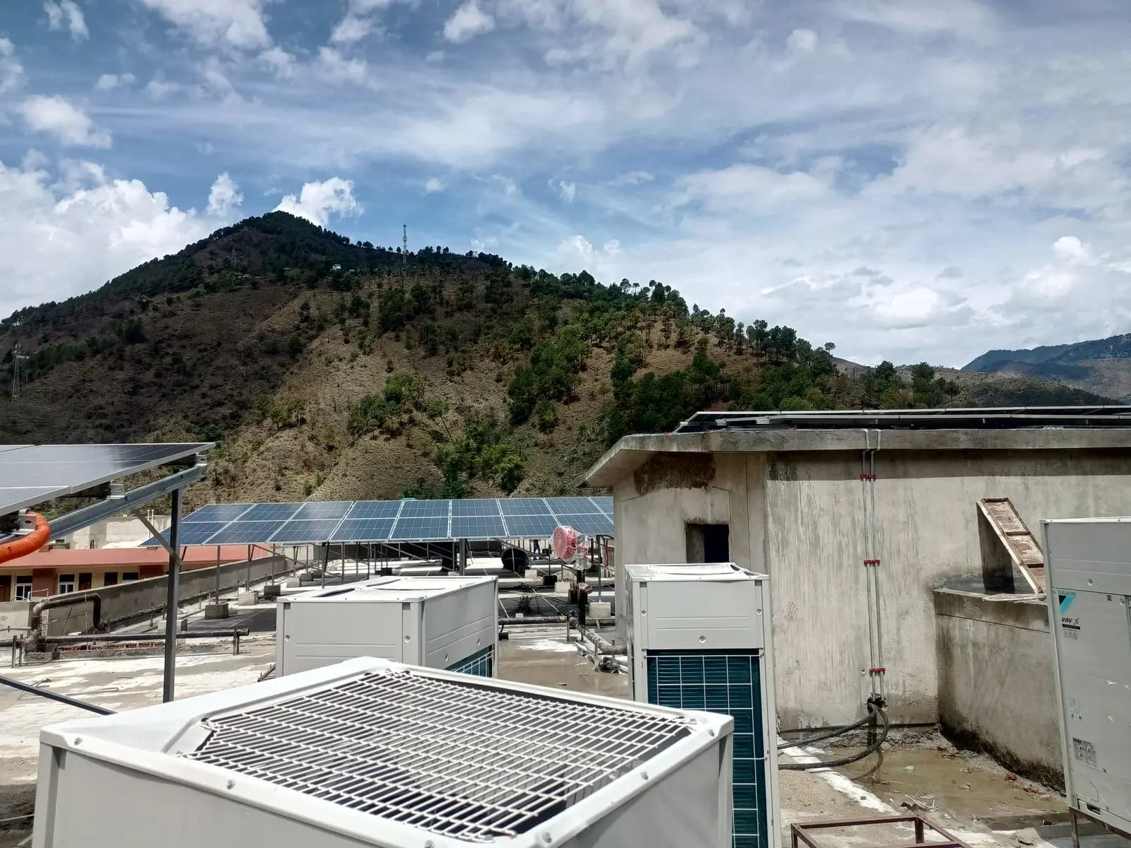 Solar arrays alongside existing rooftop services and equipment at IIT Mandi