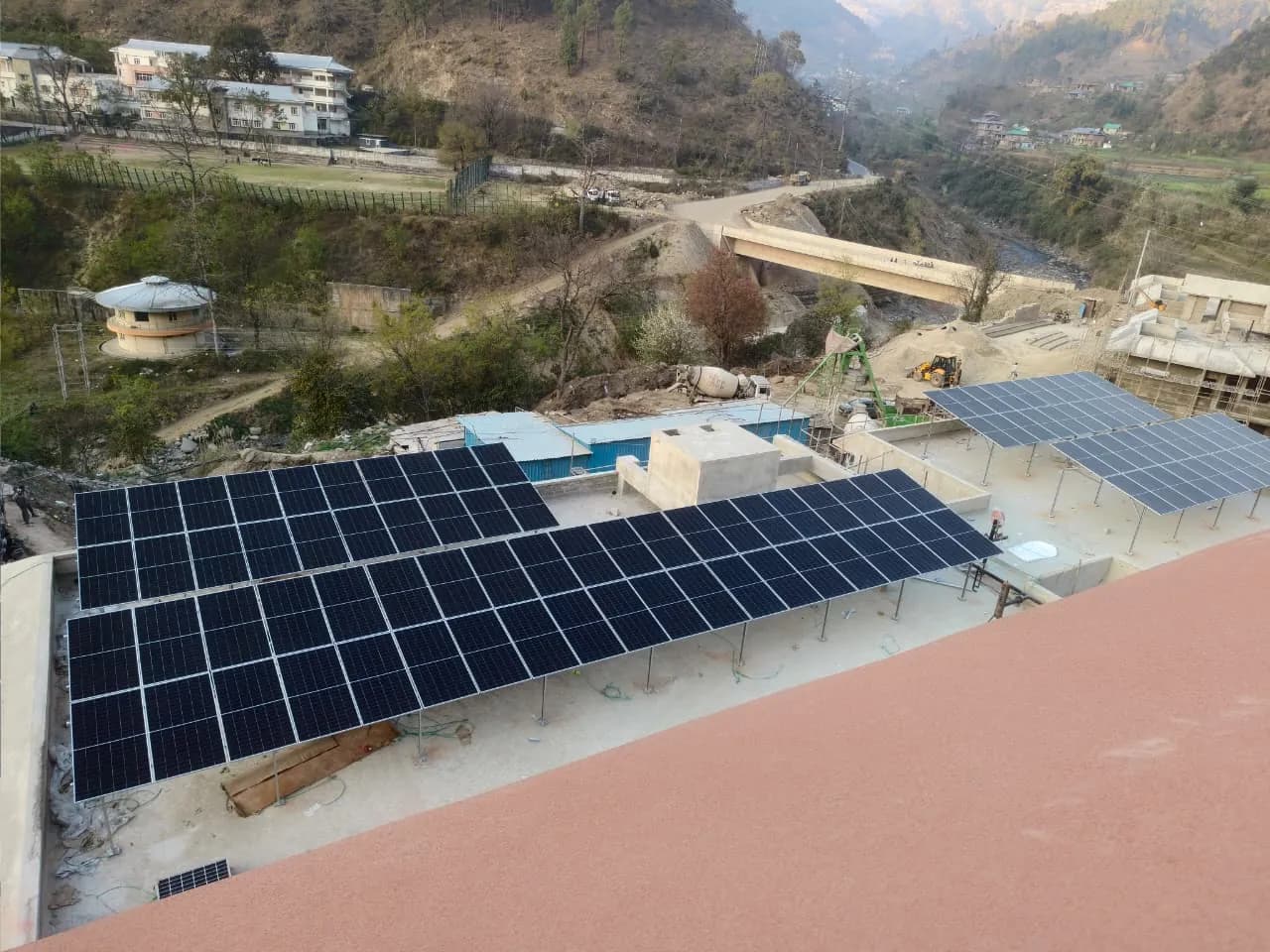IIT Mandi rooftop solar arrays overlooking the valley and a bridge