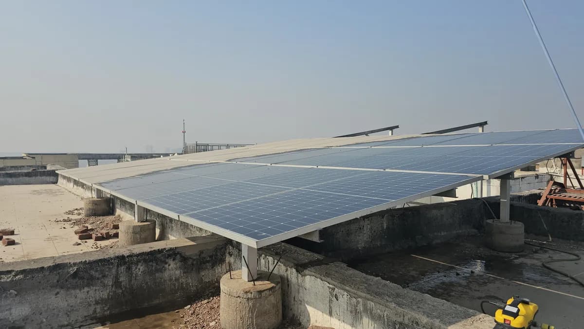 Raised solar panel mounting structure on a concrete rooftop